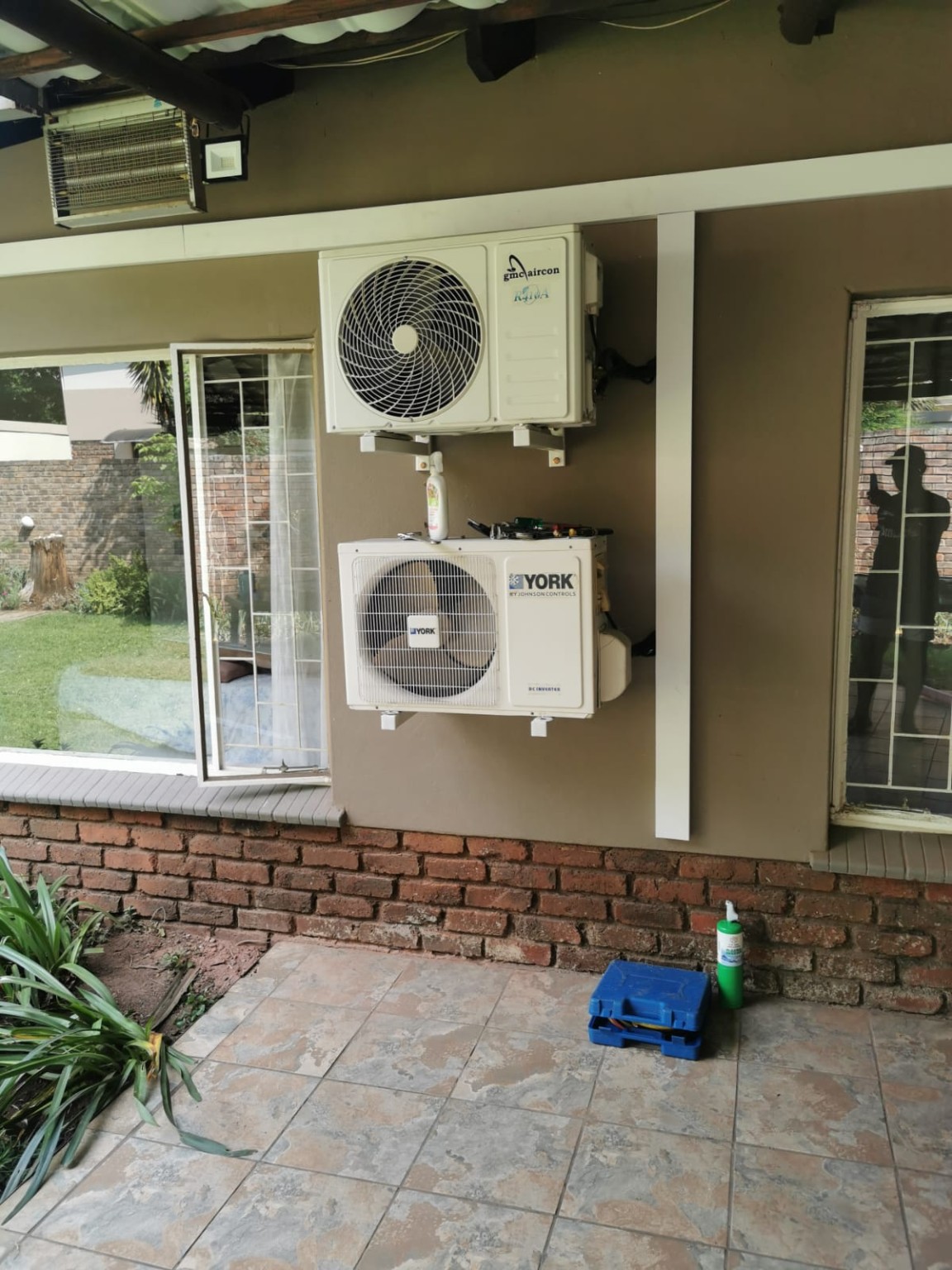 Air conditioning units professionally installed on an exterior wall